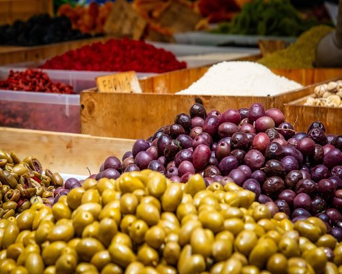 Vibrant display of fresh tropical fruits like papaya and lulo at a local Colombian market stall